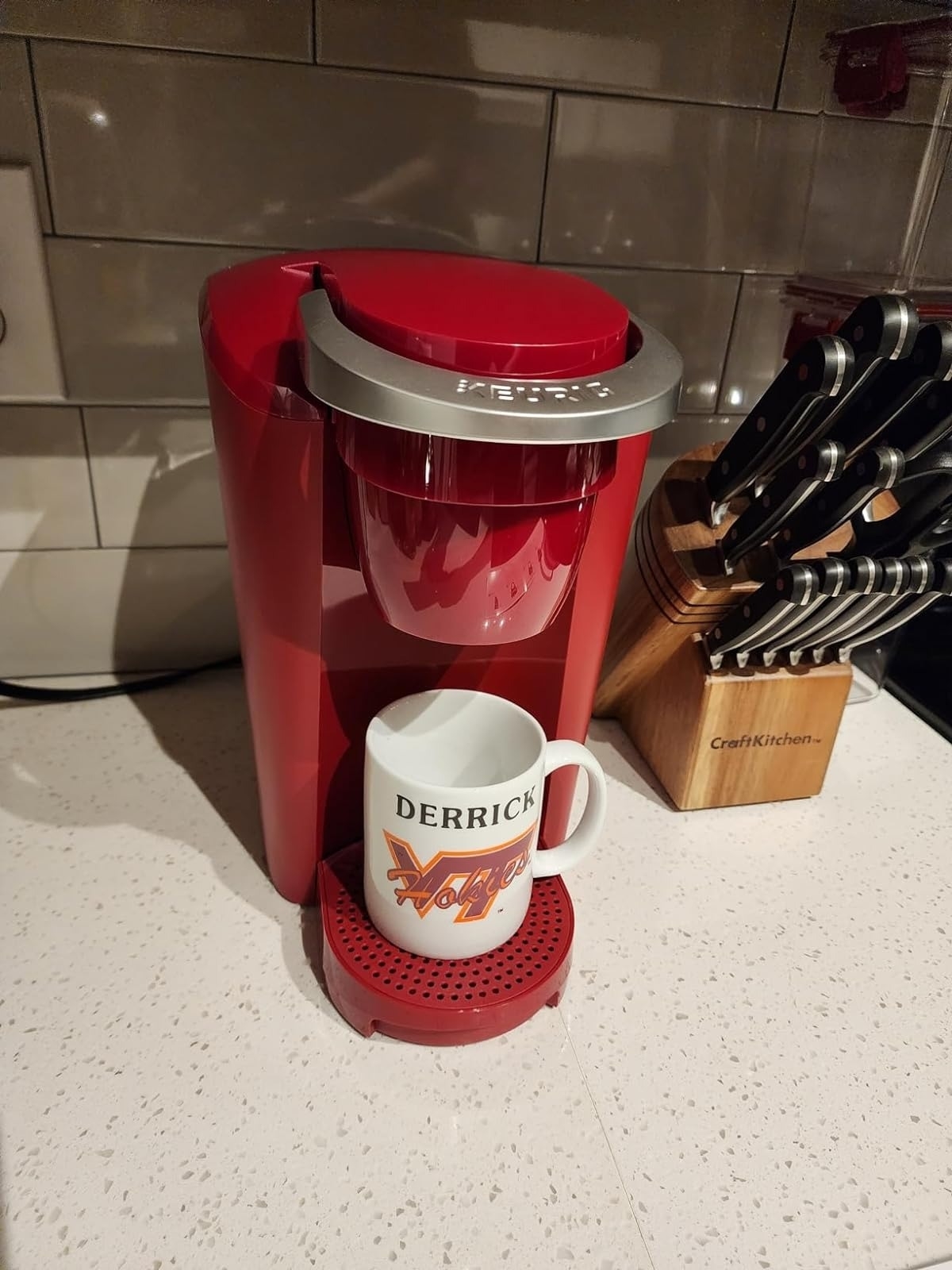 reviewer image of the red Keurig machine on a kitchen countertop