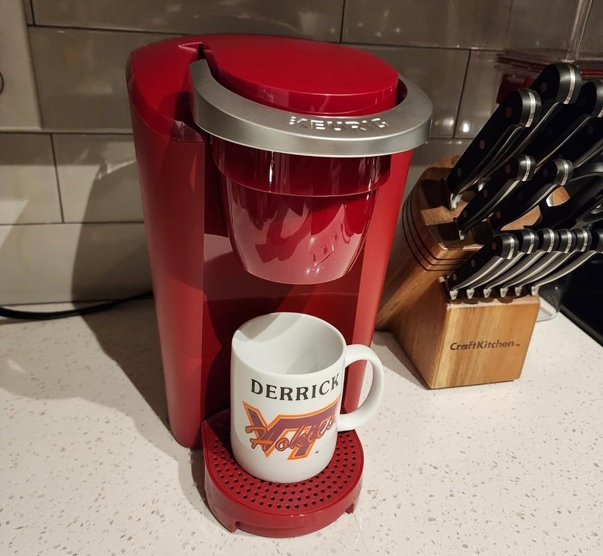 reviewer image of the red Keurig machine on a kitchen countertop