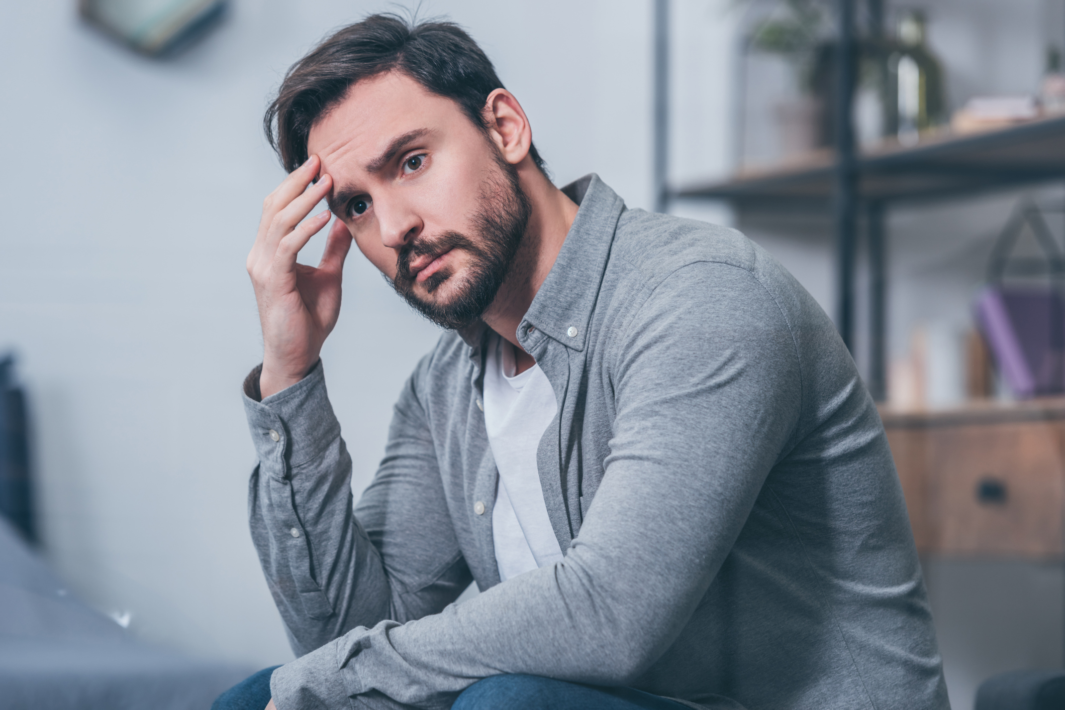 person sitting alone in his apartment