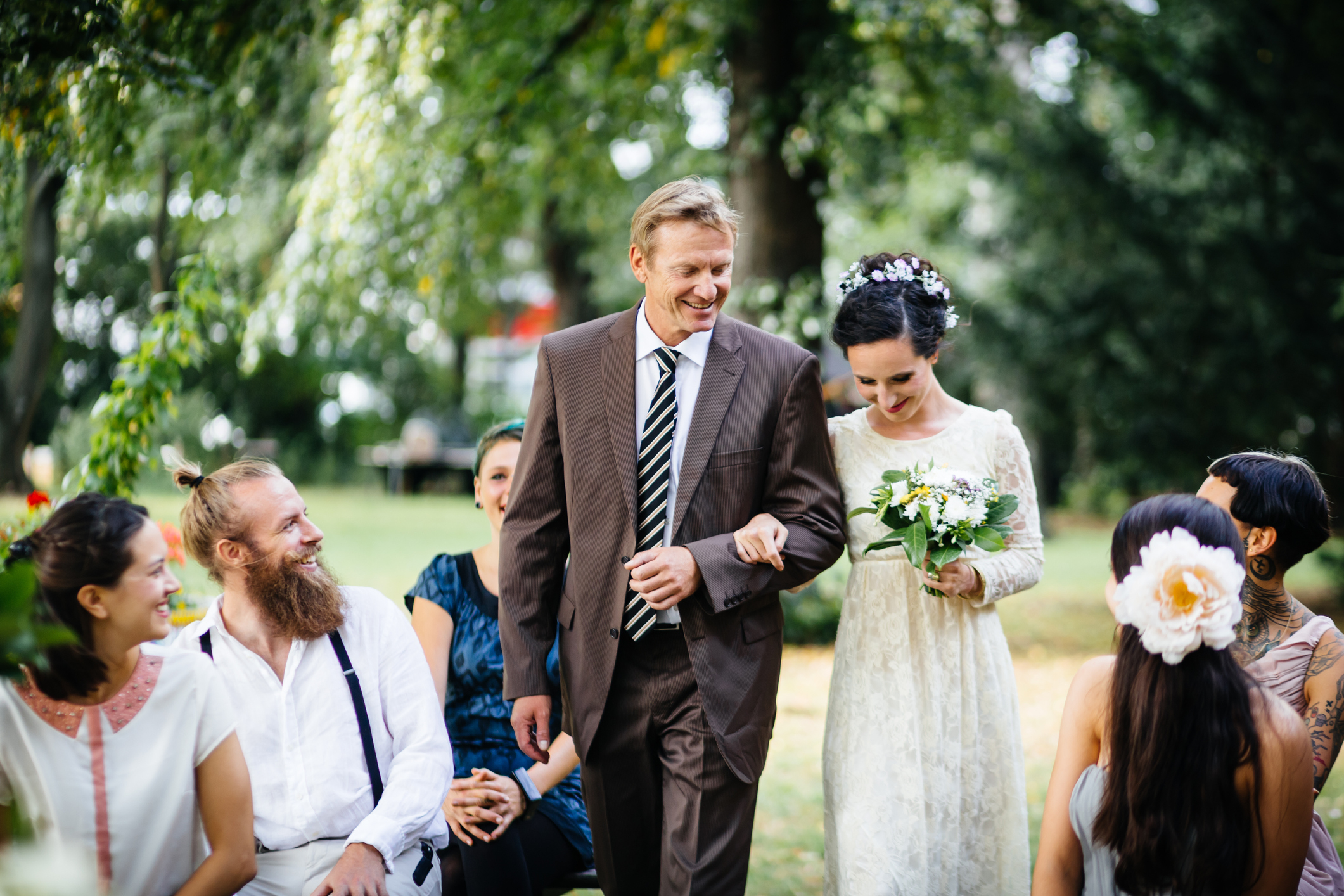 A bride walking down the aisle with her father