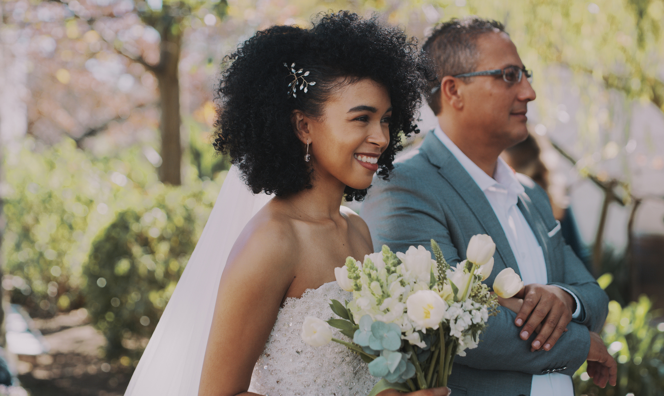 A bride with her father, about to walk down the aisle