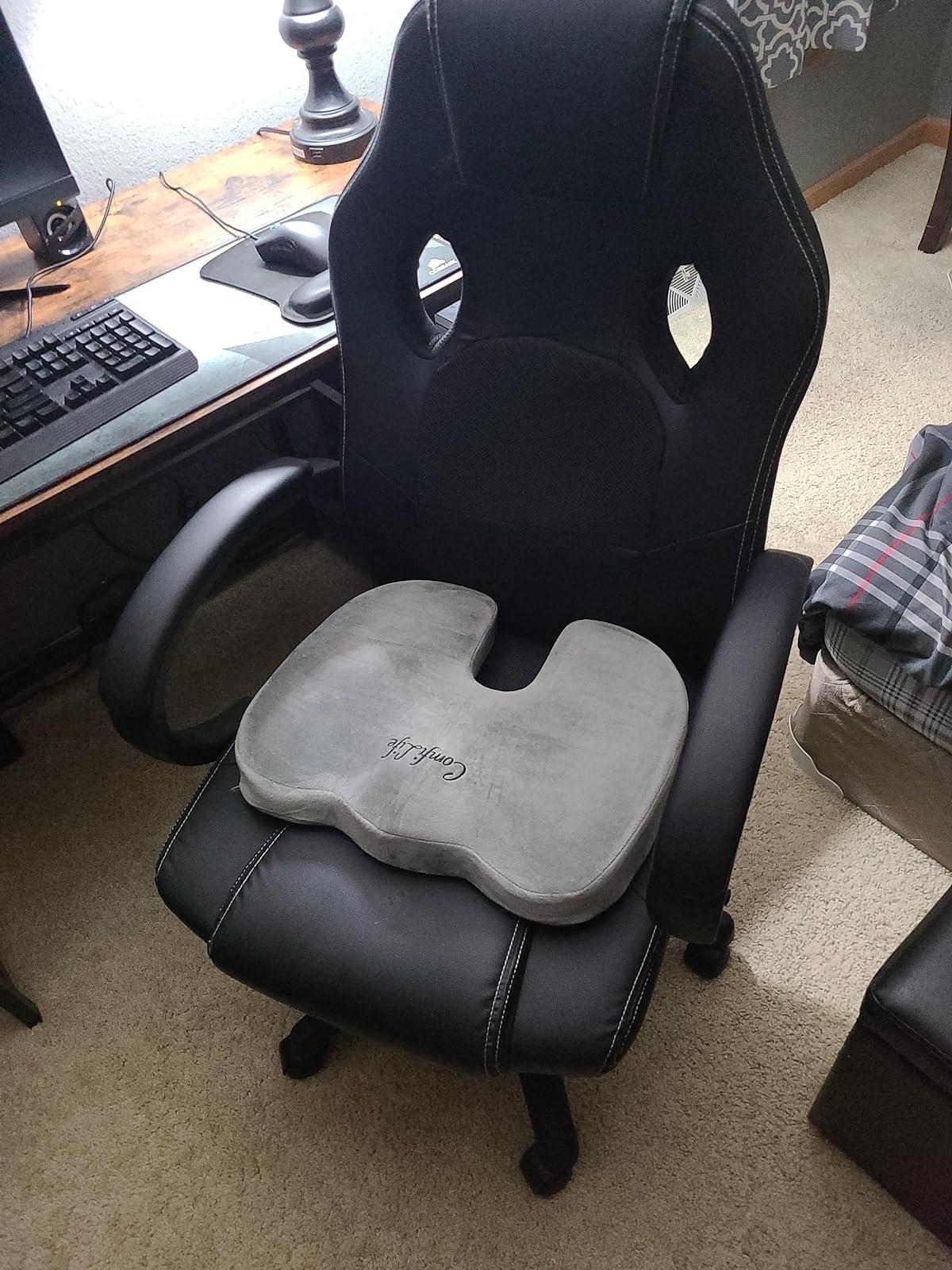 reviewer image of the grey seat cushion on an office chair
