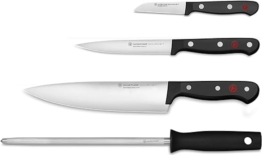 three knives of different sizes and a honing steel