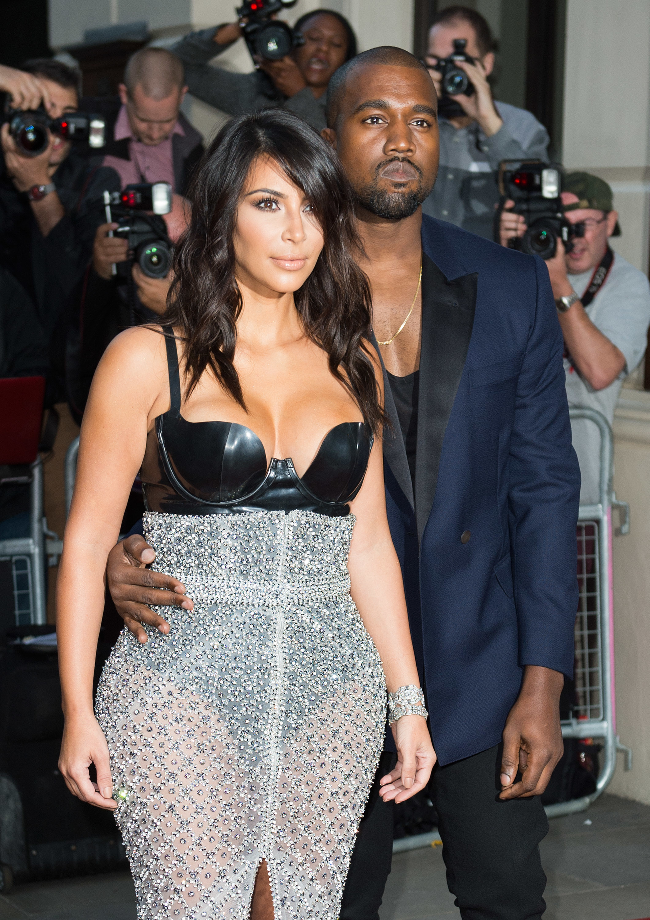 Closeup of Kim and Ye posing on the red carpet