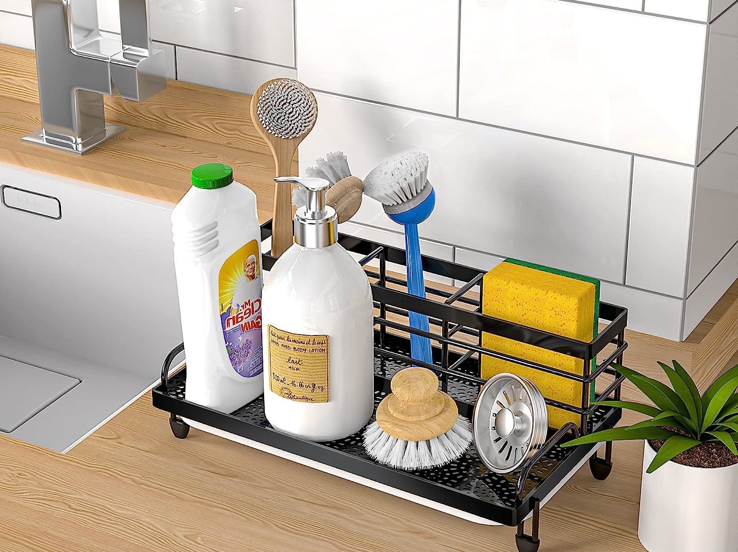 various products like a sponge, soap, scrubber brush, and sink strainer in the organizer