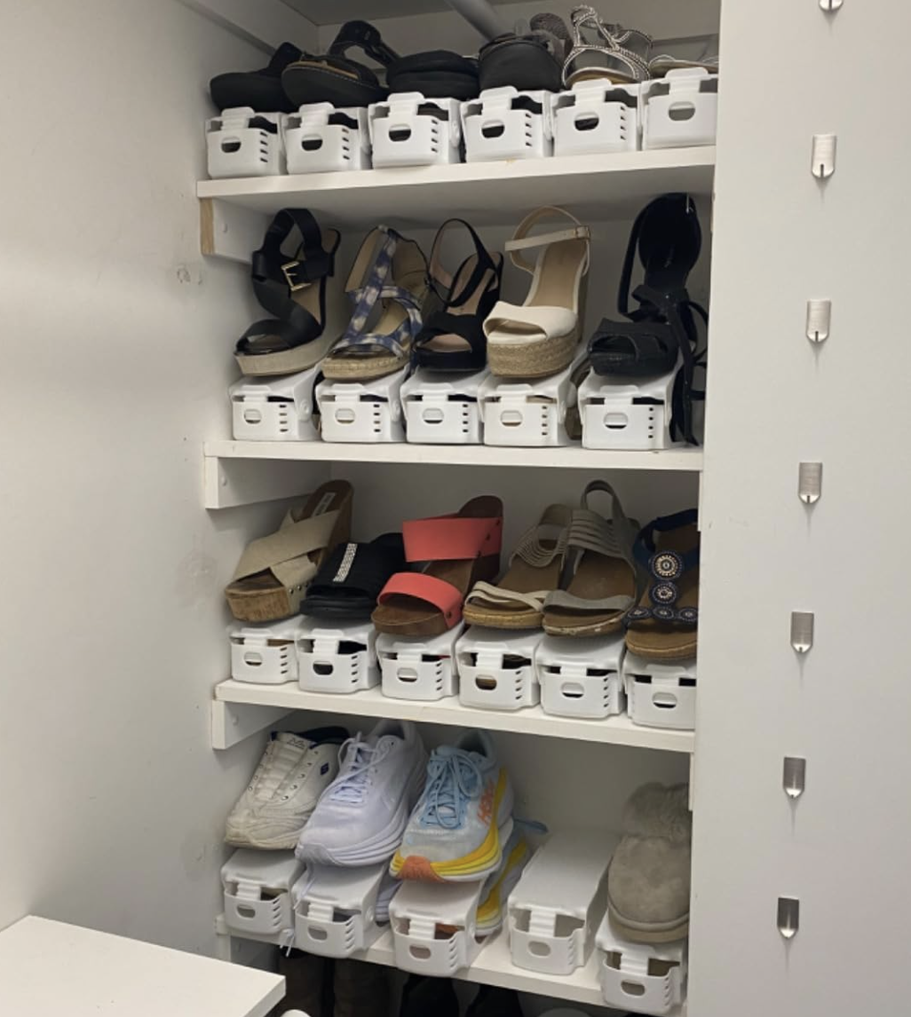 a reviewer photo of the shoe stacking units keeping their shoes organized