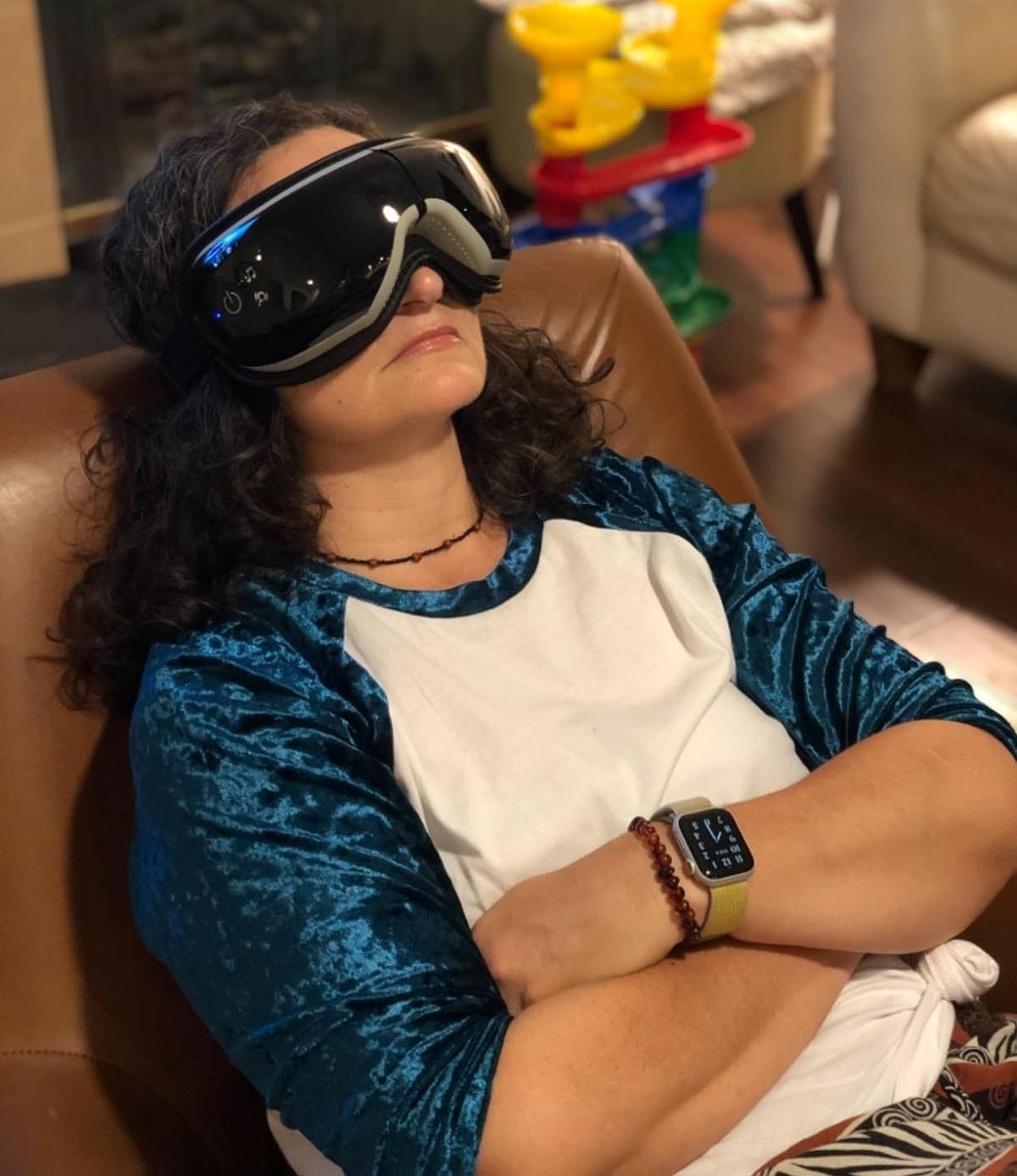 reviewer relaxing with the heated eye massager