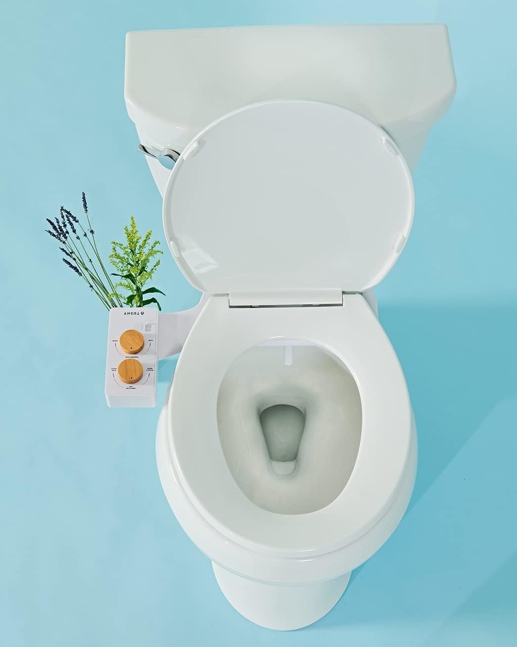 a toilet with the bidet attachment installed