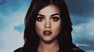 Aria Montgomery from "Pretty Little Liars" doing her shush