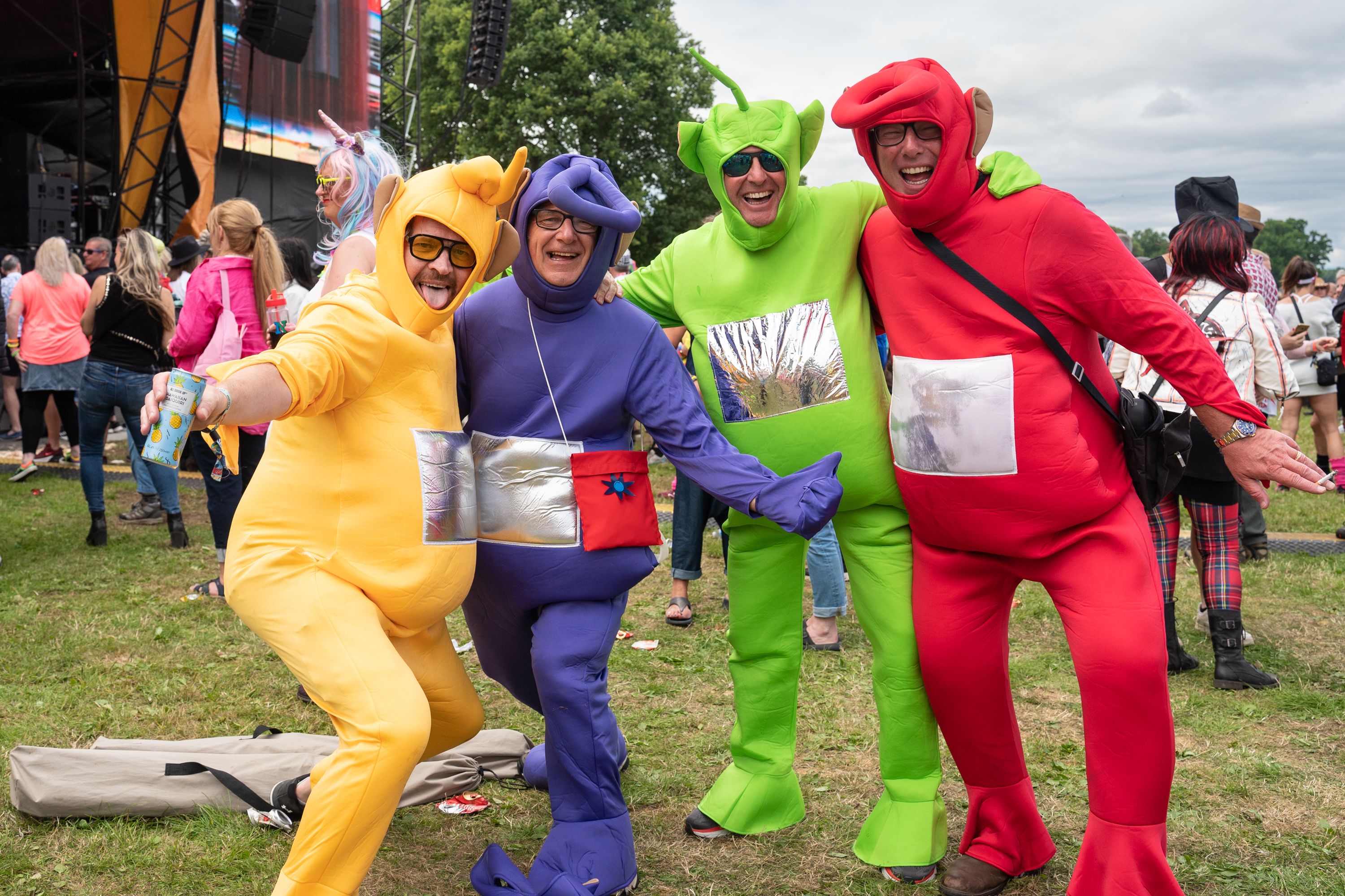 Festivalgoers dressed as Teletubbies pose during Rewind Scotland Festival 2023.