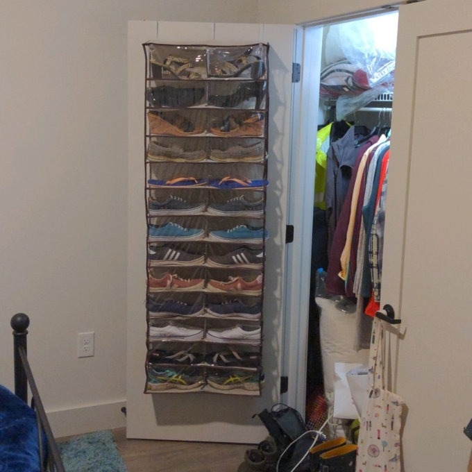 a reviewer photo of the shoe organizer inside a closet door