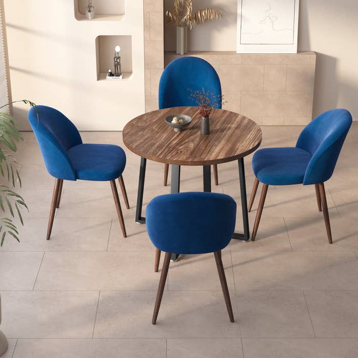 the dining set with a brown wood table and blue chairs