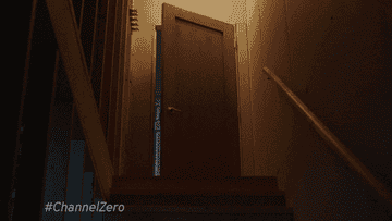 Man opening the door to a basement