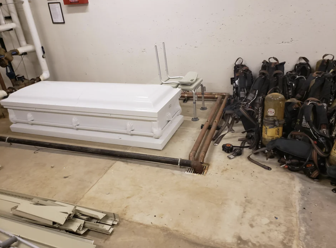 A casket against a wall in a fire station