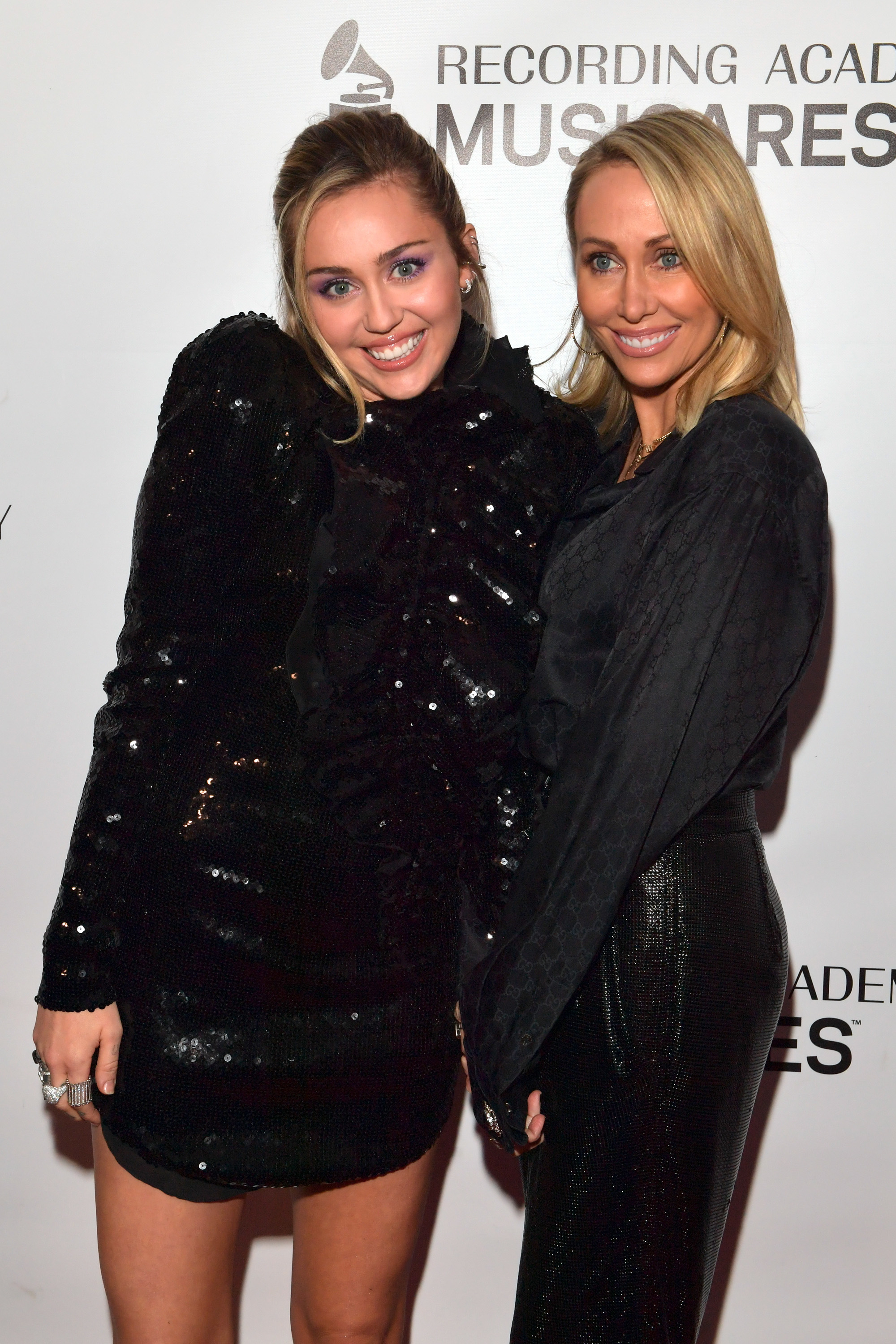 Close-up of Miley and Tish at a media event