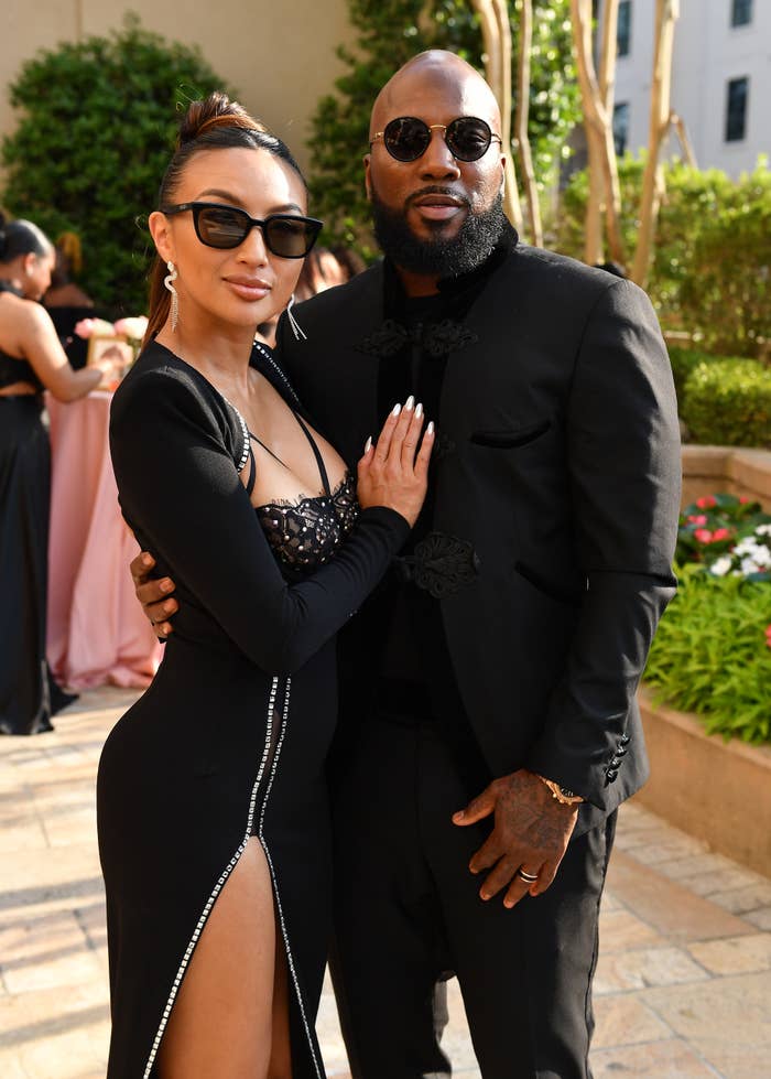 Jeannie and Jeezy with their arms around each other as they pose for a photo together outside at an event