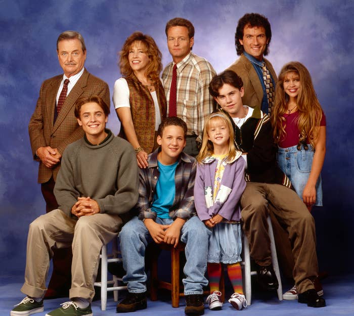 The cast of Boy Meets World sitting and standing together