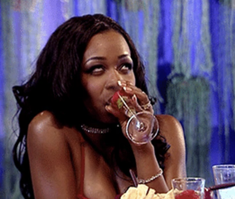 Tiffany Pollard on "Flavor of Love" rolling her eyes as she sips wine