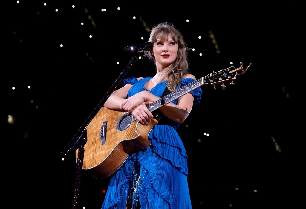 Taylor onstage with a guitar