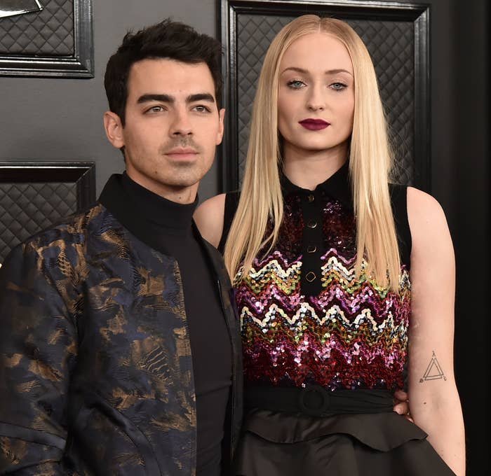 Joe Jonas and Sophie Turner standing at a red carpet event