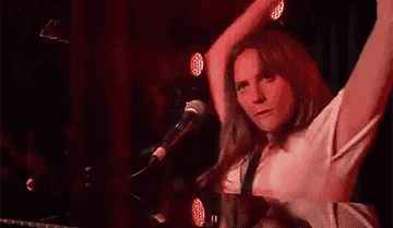 Lady Gaga in "A Star Is Born" pointing to the crowd