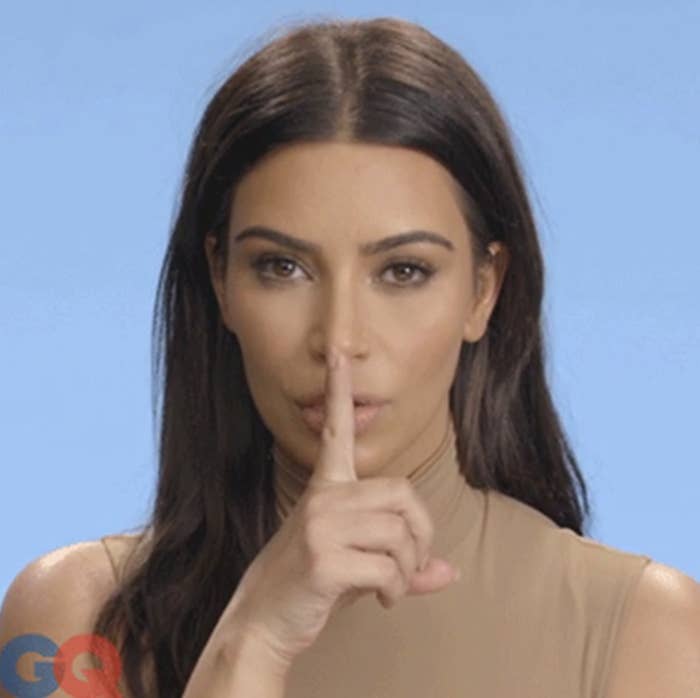 Kim Kardashian in GQ video with a finger over her lips
