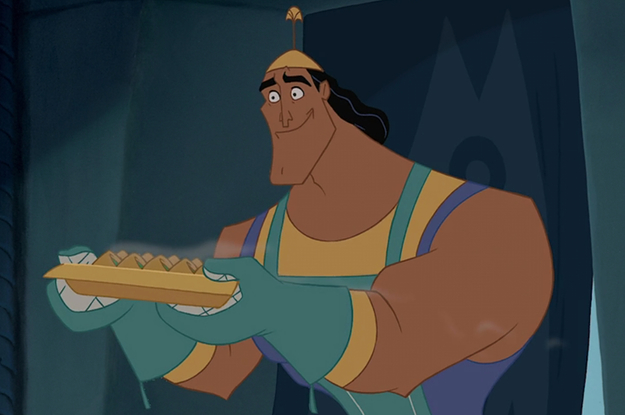 Kronk from The Emperor's New Groove opening his eyes wide and holding a tray of spinach puffs