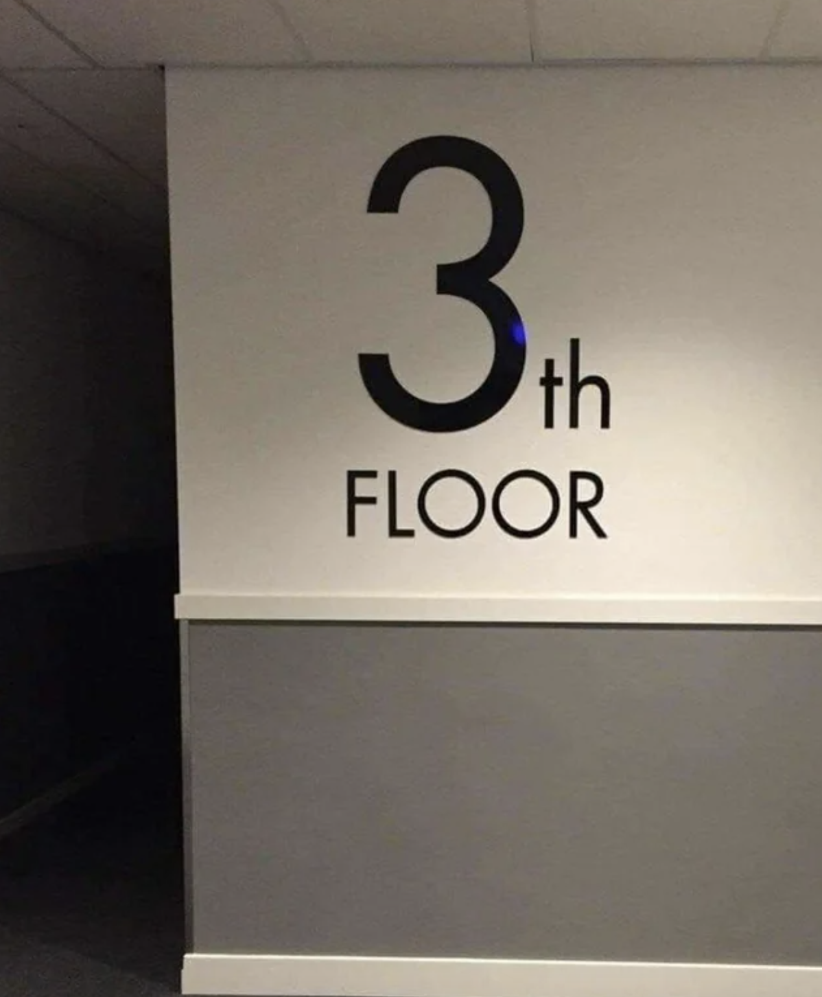 Large numbers and letters on the wall say this is the 3th floor instead of the 3rd floor
