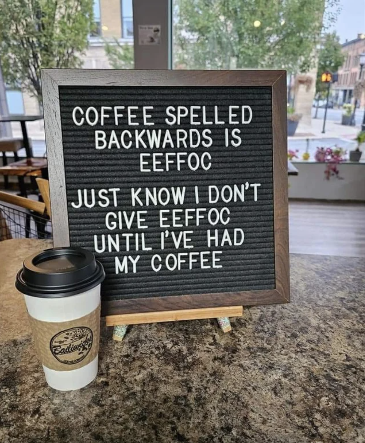 A sign at a coffee shop says "coffee spelled backward is eeffoc. Just know I don't give eeffoc until I've had my coffee"