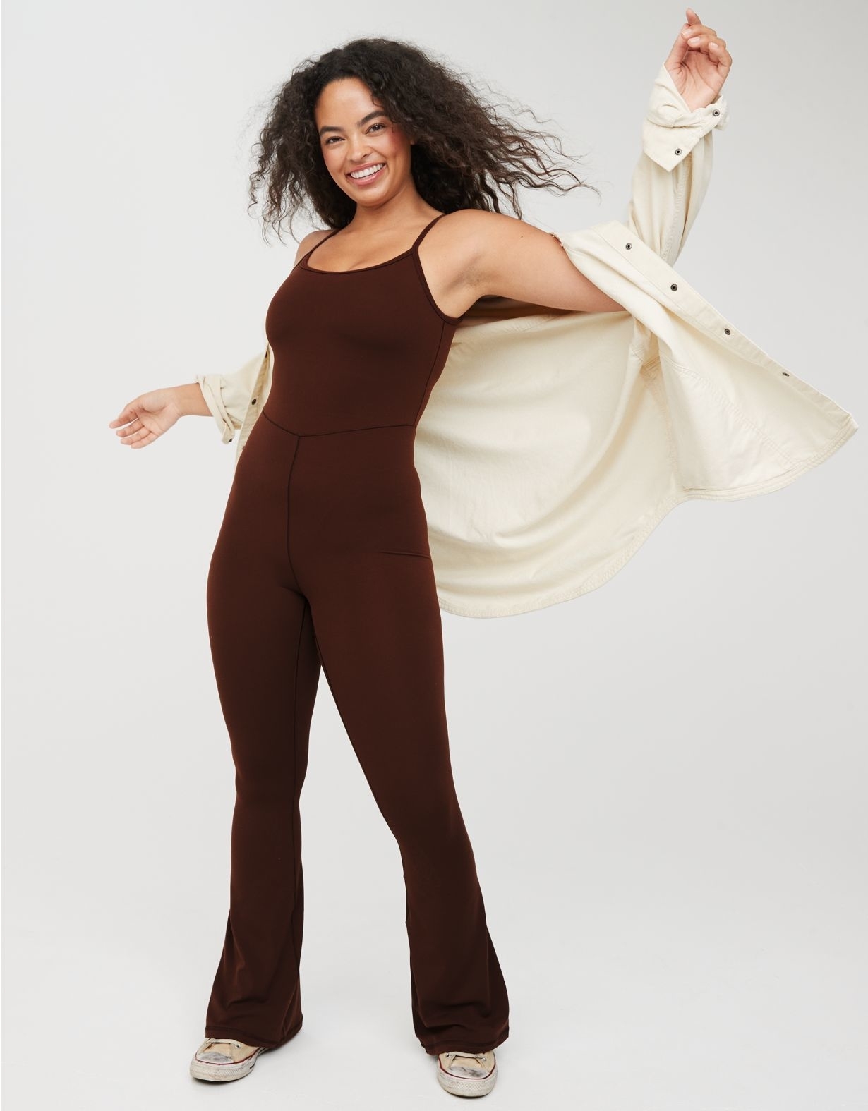 A model wearing the jumpsuit in brown