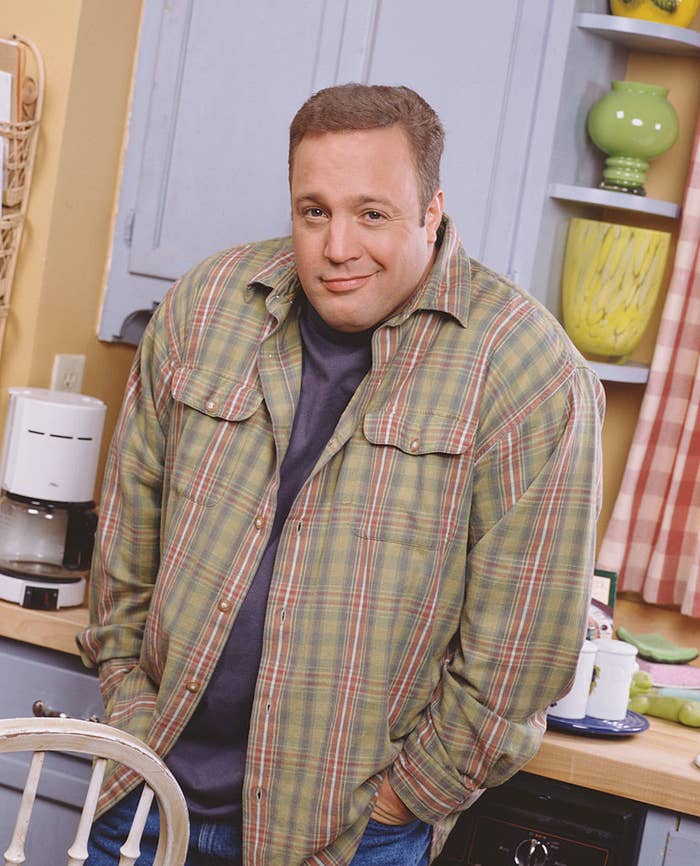 Promotional portrait of American actor and comedian Kevin James in costume as the character Doug Heffernan as he poses with his hands in his pockets on the set of the television sitcom &#x27;The King of Queens,&#x27; in the late 1990s