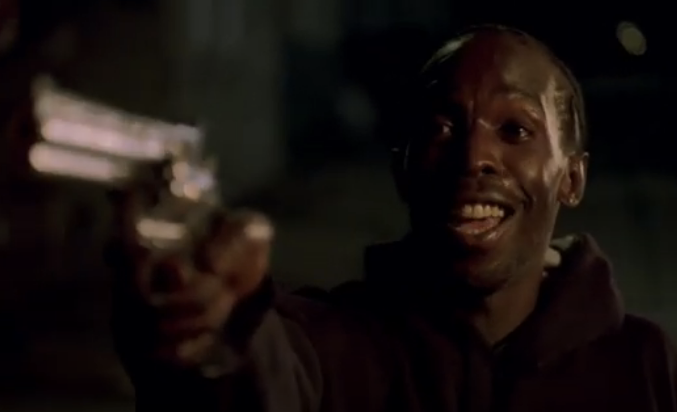 Omar Little from The Wire holding up a gun