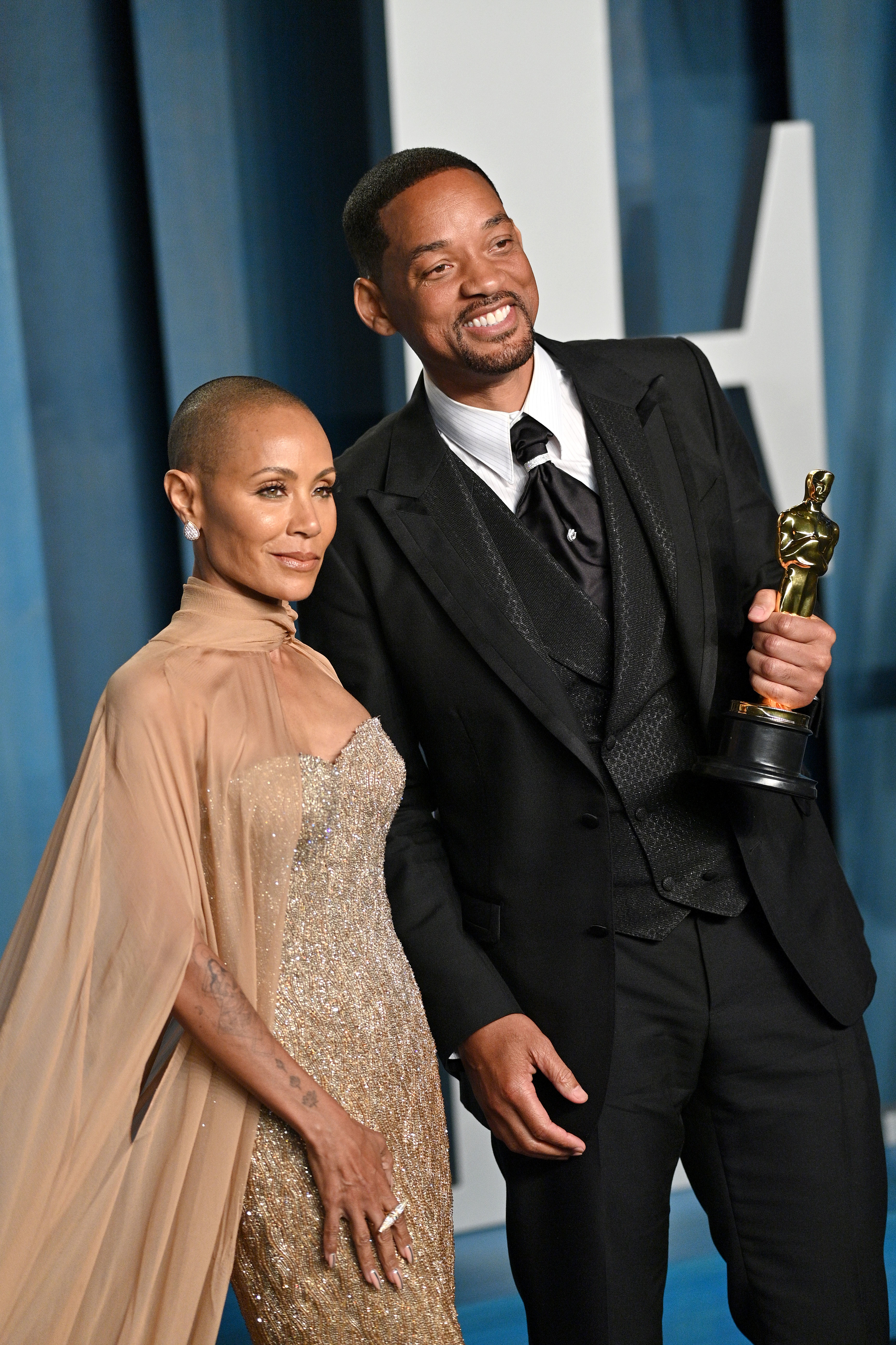 Close-up of Will and Jada smiling at the Oscars