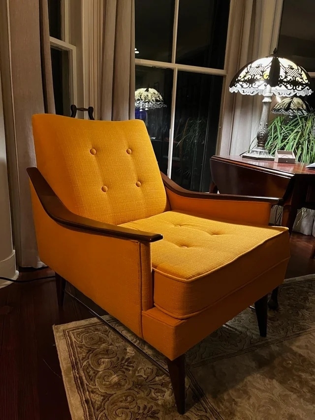 An after image of a yellow armchair with thick cushions