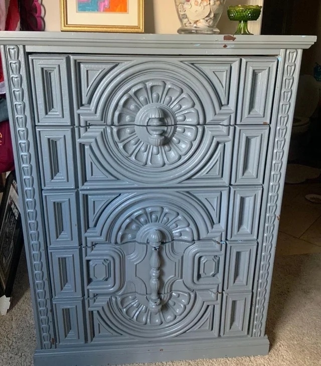 A before image a an ornate chest of drawers painted gray