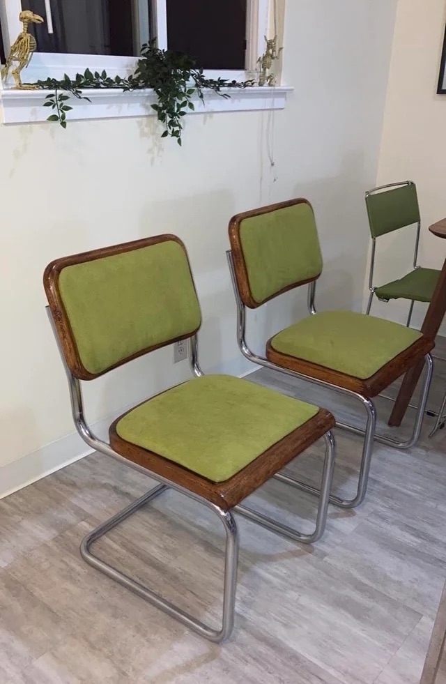 The chairs after with a dark wood stain and green upholstery