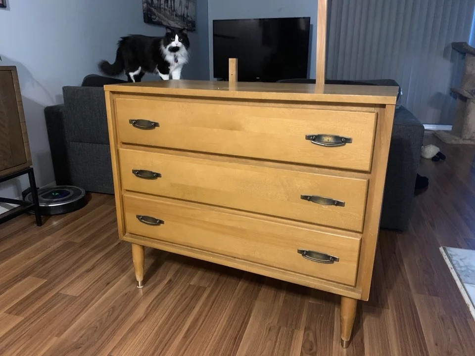 A before image of a three-drawer pine dresser
