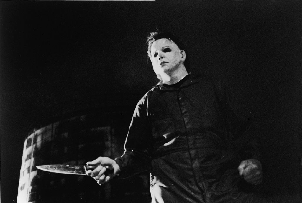 Michael Myers in his famous get up wielding a knife