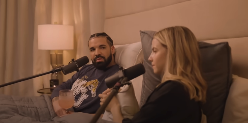 Drake and Bobbi conducting their interview in bed