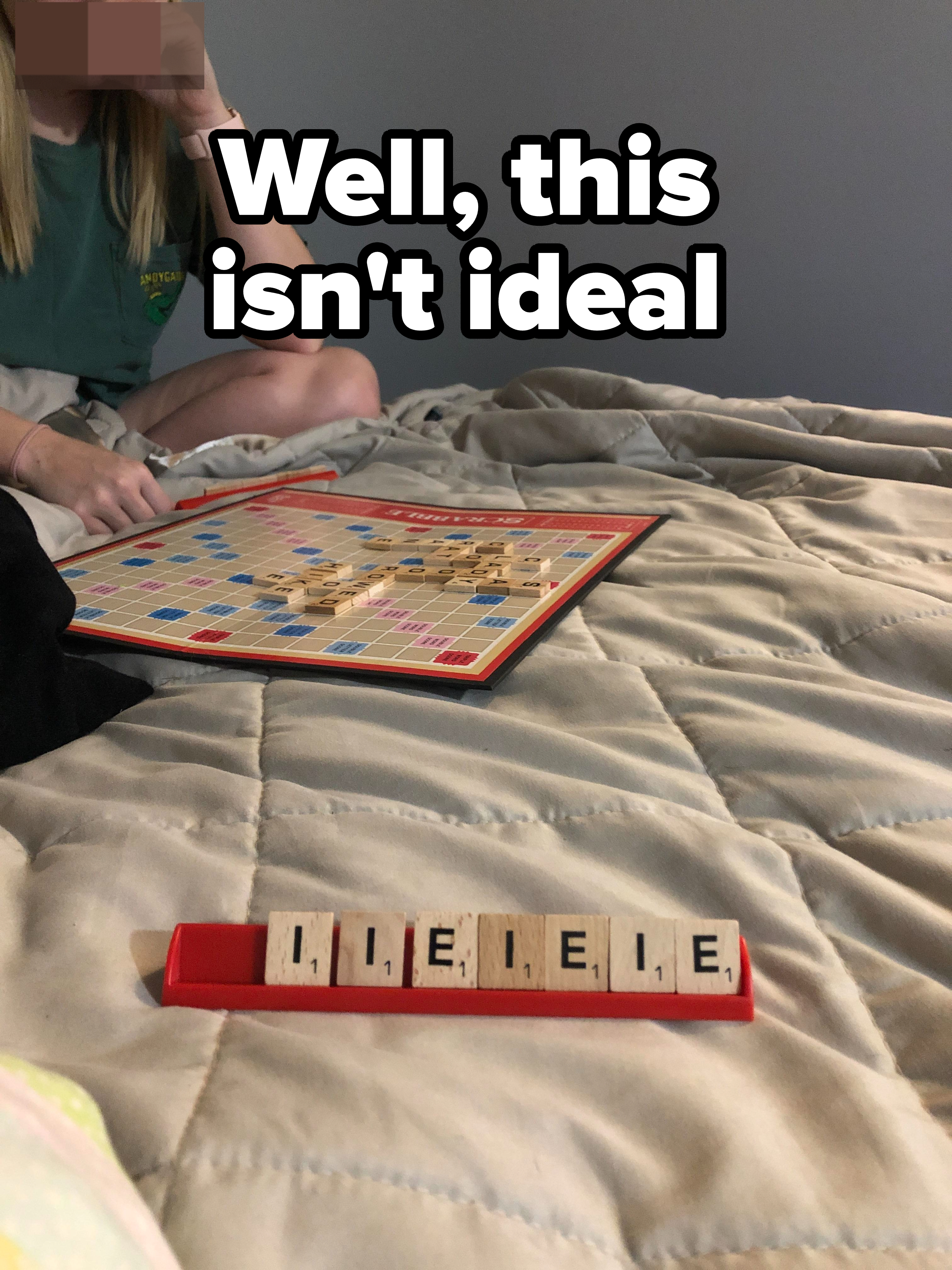 A person playing Scrabble with these letters: &quot;IIEIEIE,&quot; each worth 1 point