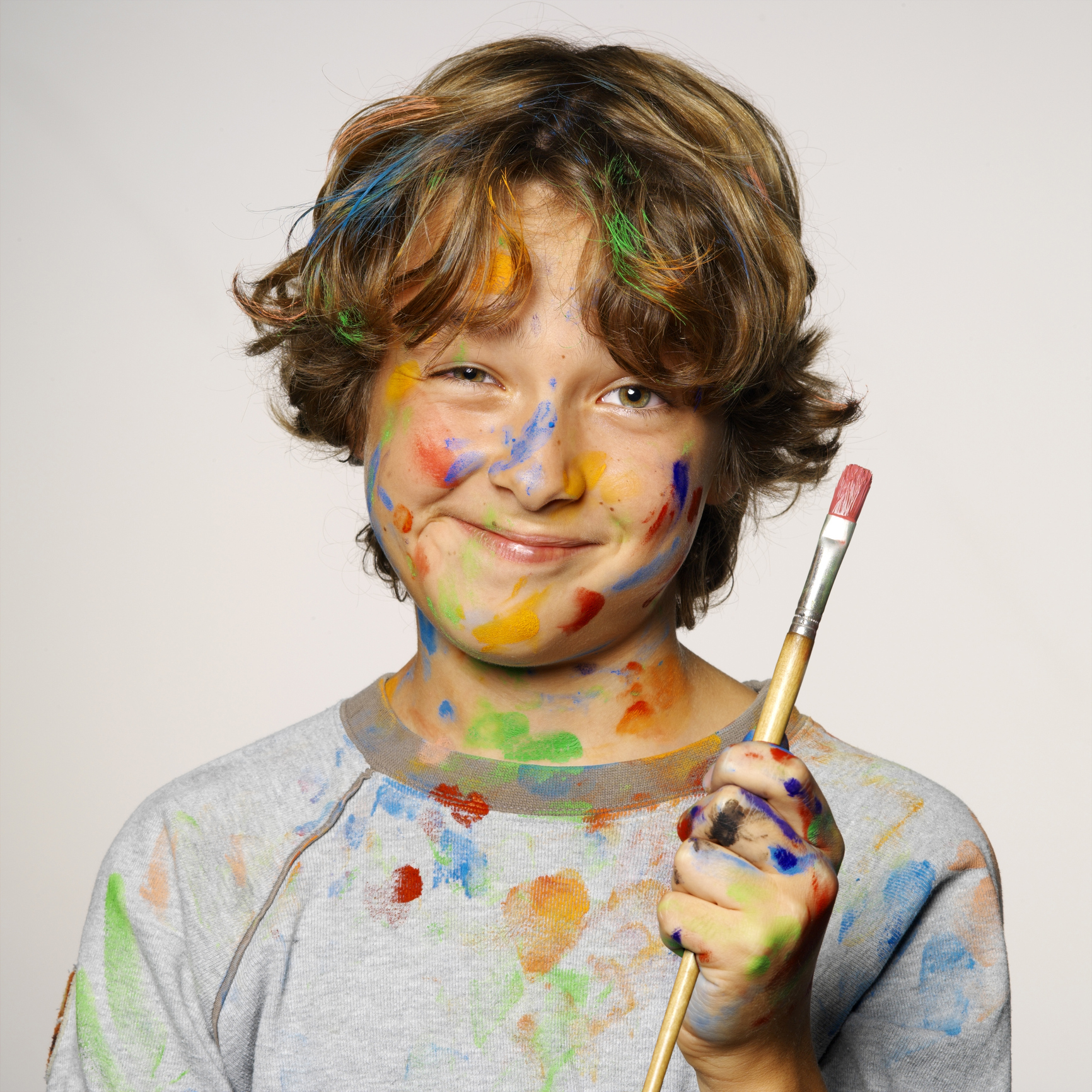 A boy covered in paint