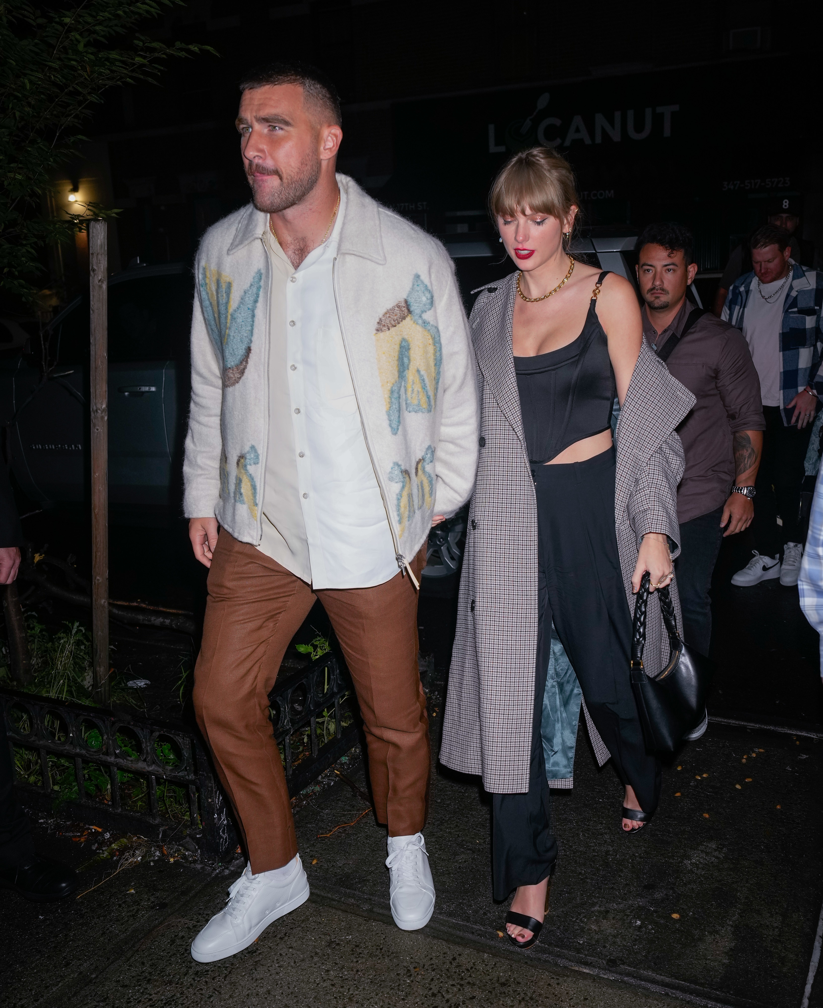 Close-up of Taylor and Travis walking