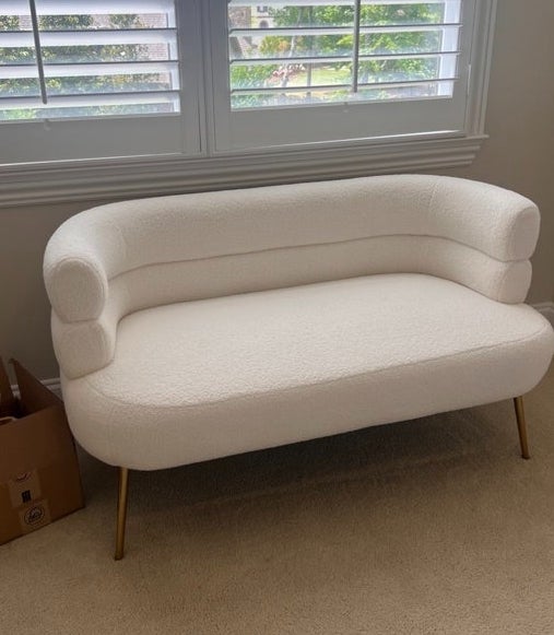 the loveseat with a curved silhouette