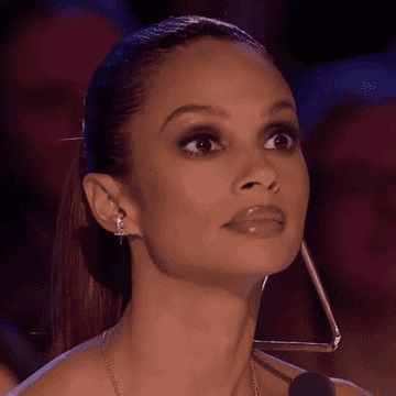 Alesha Dixon&#x27;s looks left to right with her eyes wide open in shock