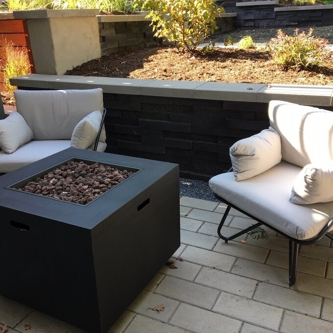The set of white patio chairs around a reviewer&#x27;s fire pit