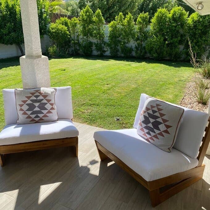 The modern patio chairs on a reviewer&#x27;s patio