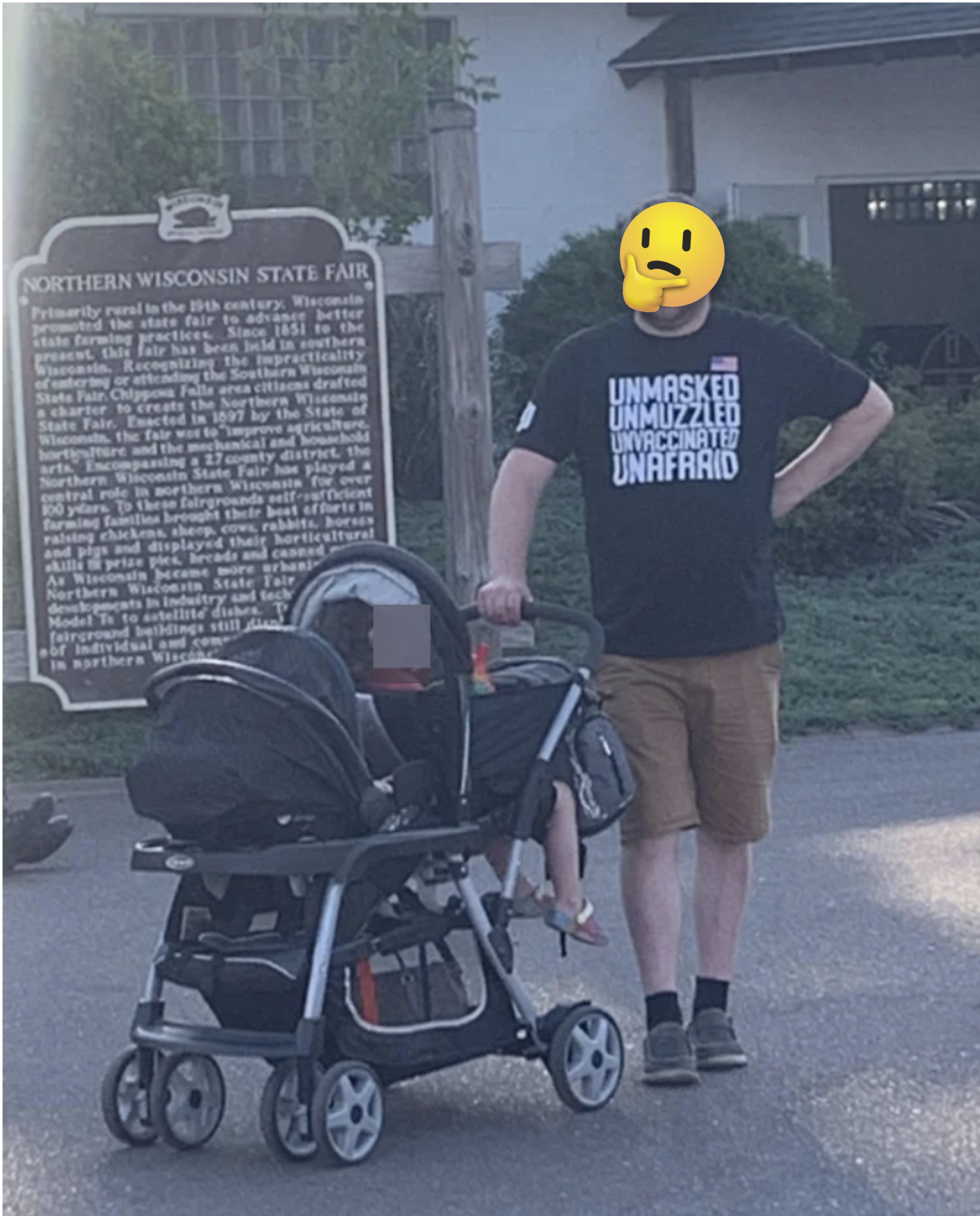 A man pushing a stroller and wearing a shirt that says &quot;unmasked, unmuzzled, unvaccinated, unafraid&quot;