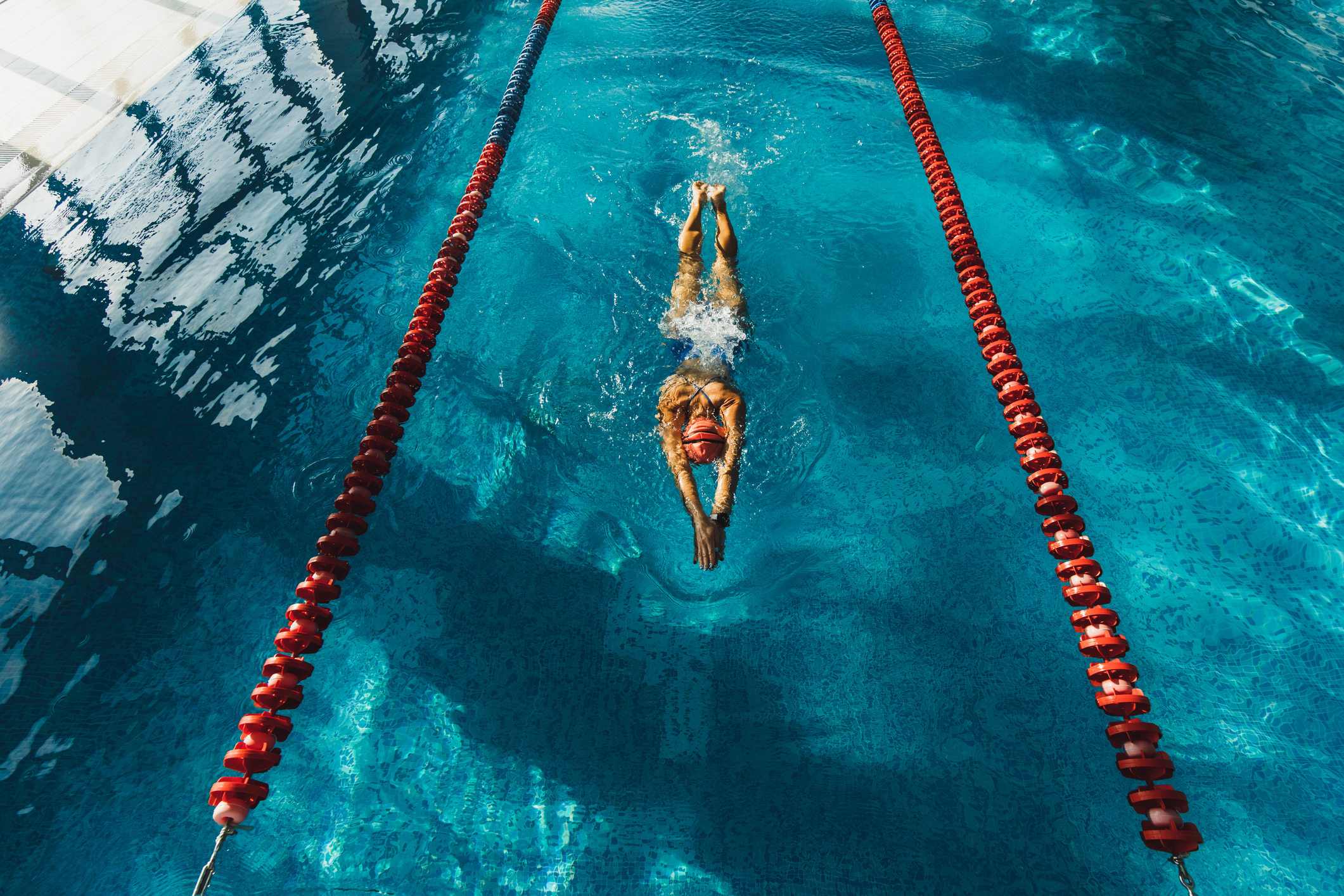 A swimmer is doing laps in a pool