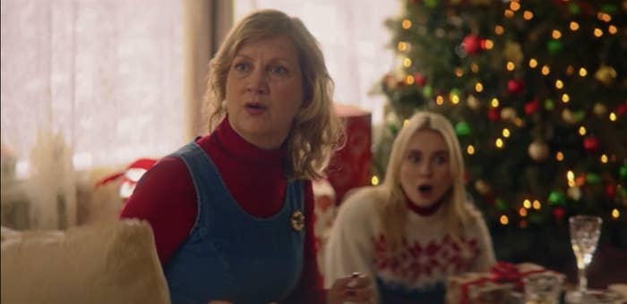 Mother and daughter look shocked by Christmas tree