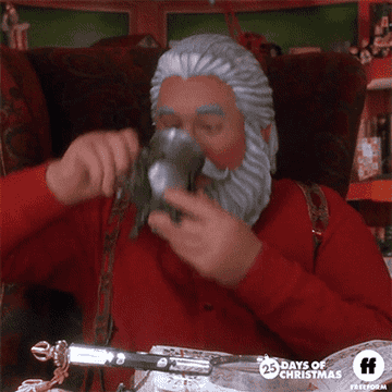 a robot from the santa clause excitedly drinking cocoa